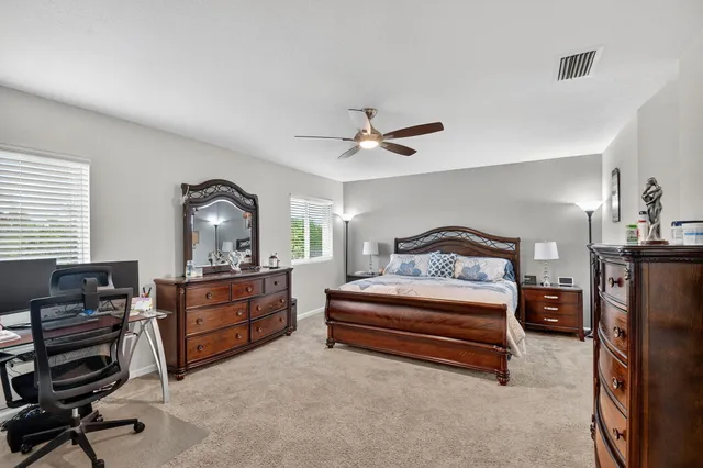 a livingroom with workspace and a couch