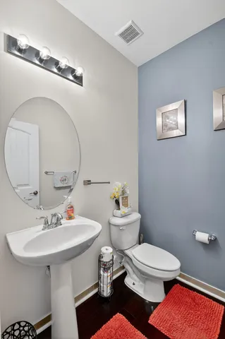 a view of a patio with a table chairs and a potted plant