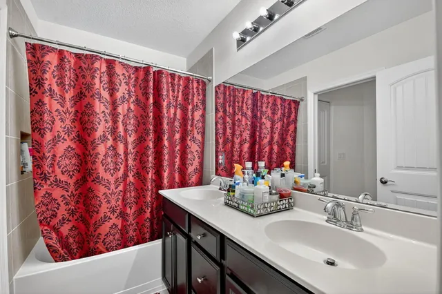 a view of a house with backyard porch and sitting area