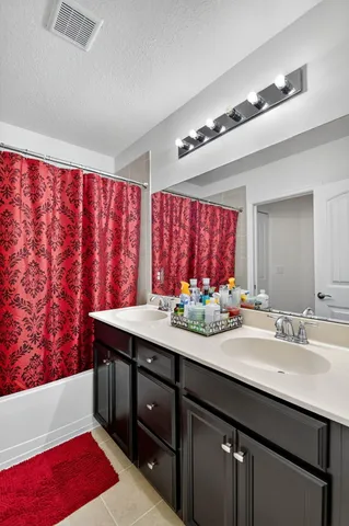 a front view of a house with garden and patio