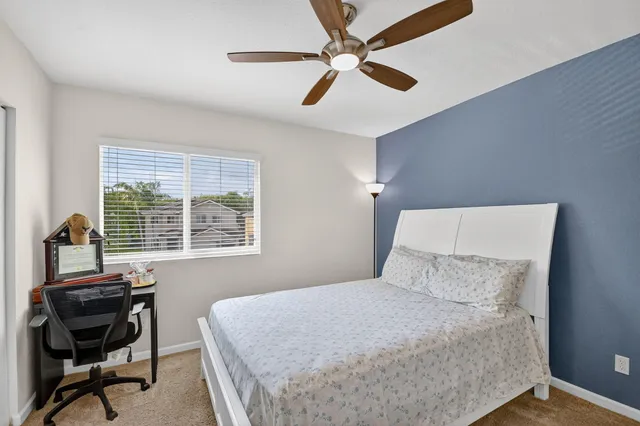 a view of a house with backyard sitting area and garden