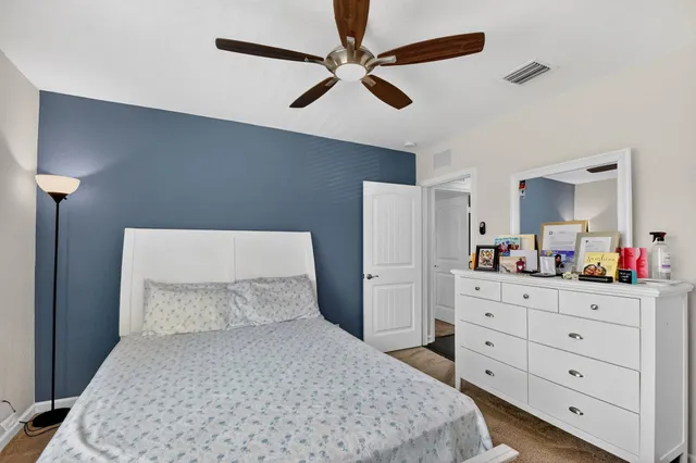 a house view with outdoor seating space and garden