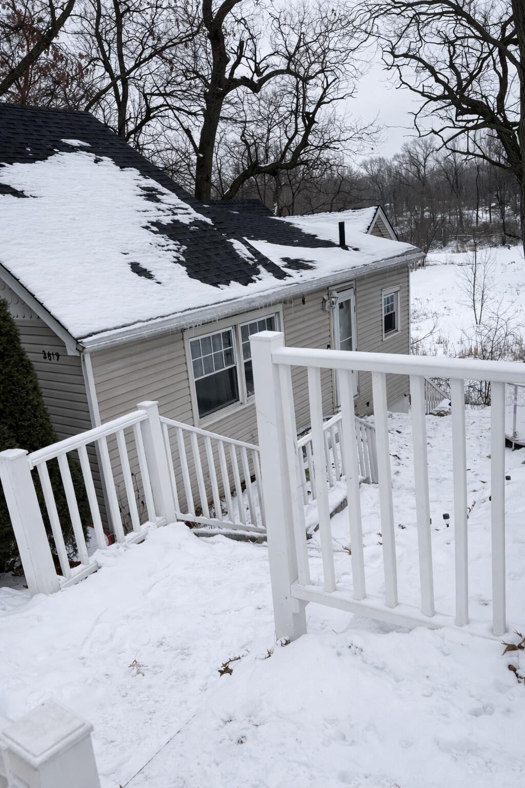 2619 Riverside Drive Lake Station, IN 46405 - Photo 18 of 21 a view of a house with a wooden fence