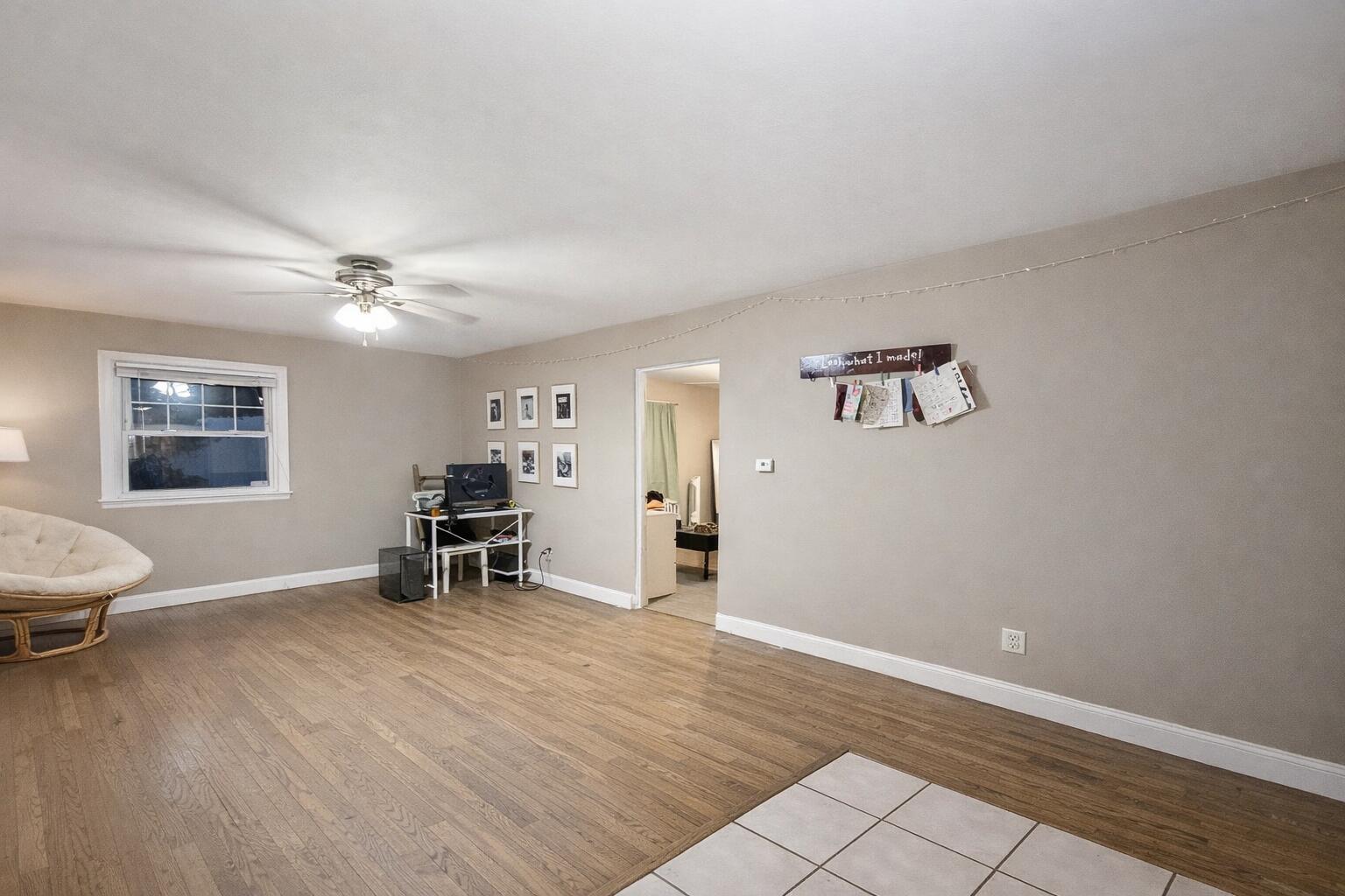 2619 Riverside Drive Lake Station, IN 46405 - Photo 2 of 21 a view of a livingroom with furniture and a ceiling fan