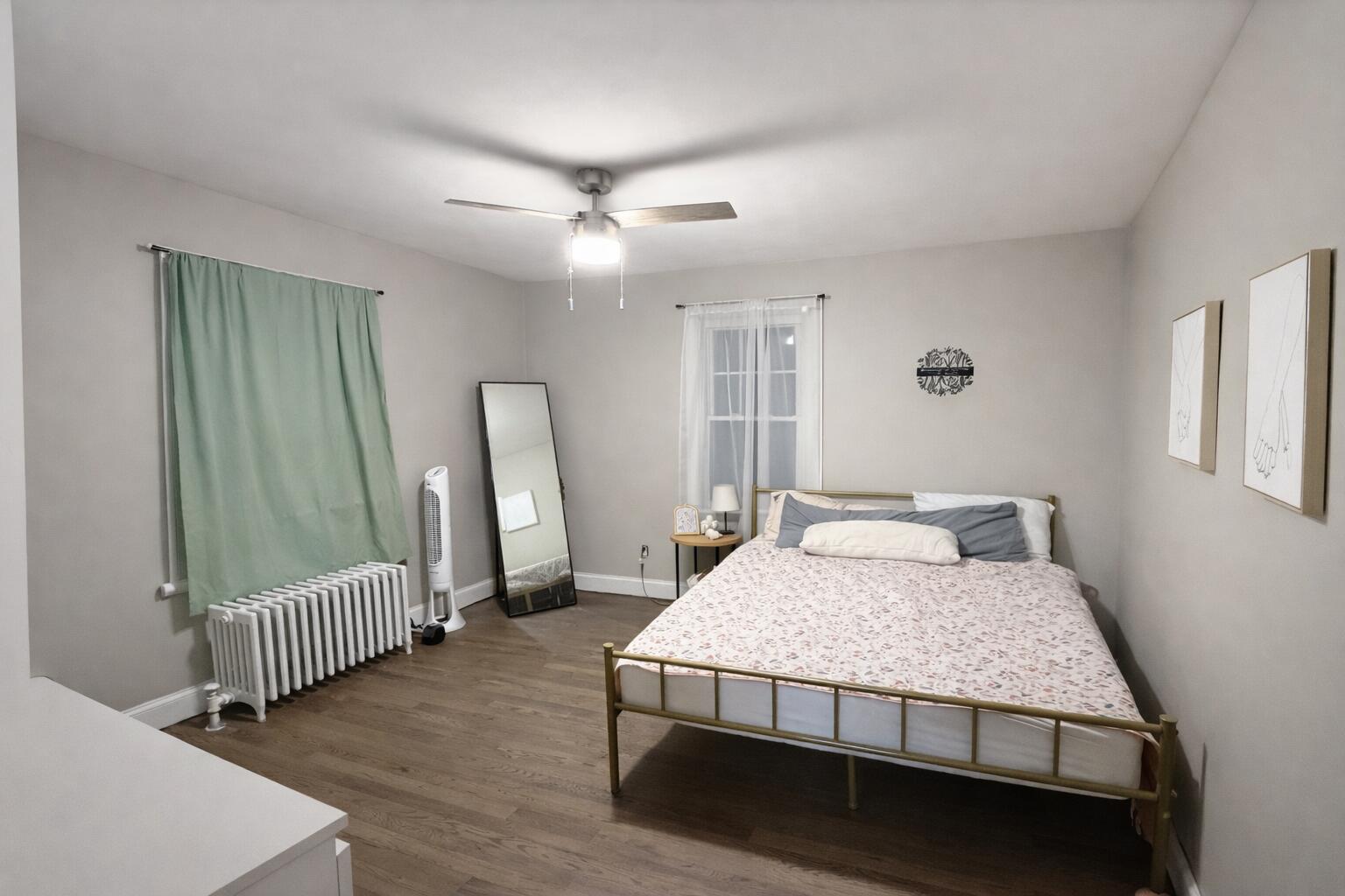 2619 Riverside Drive Lake Station, IN 46405 - Photo 5 of 21 a bedroom with a bed mirror and a window