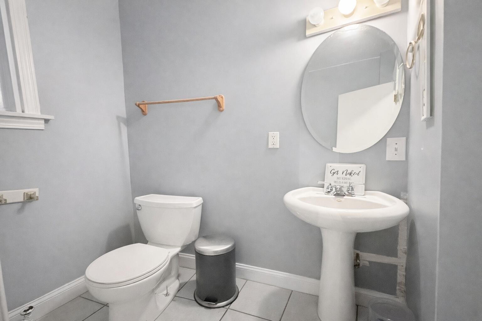 2619 Riverside Drive Lake Station, IN 46405 - Photo 6 of 21 a bathroom with a toilet a sink and mirror