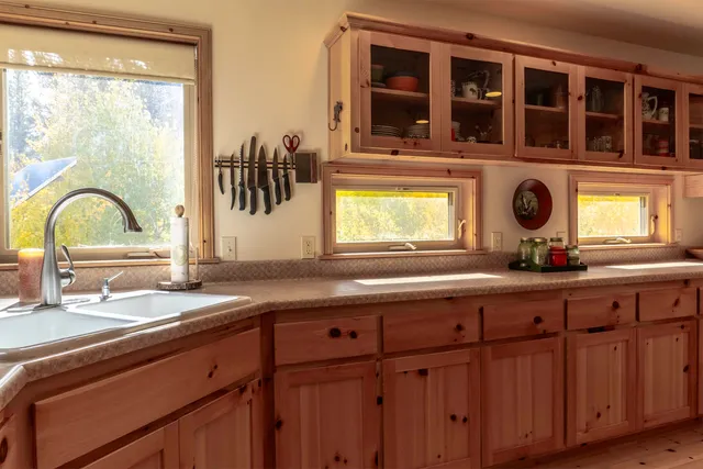 a kitchen with a sink and a window