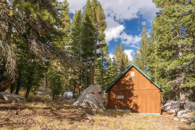 a view of barn with green space