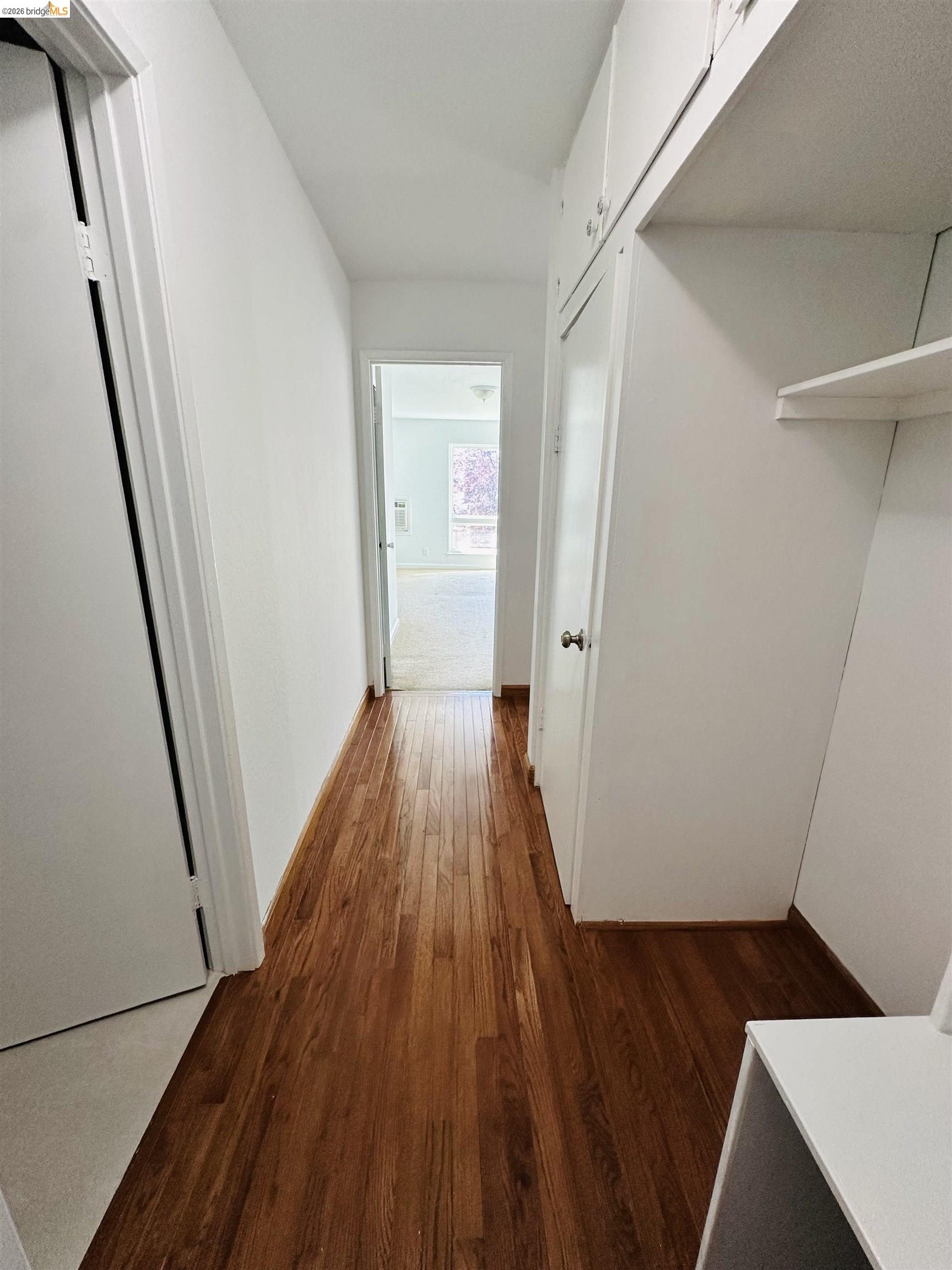 9005 Alcosta Boulevard, Unit 189 San Ramon, CA 94583 - Photo 11 of 20 Hallway featuring dark wood-style flooring and baseboards