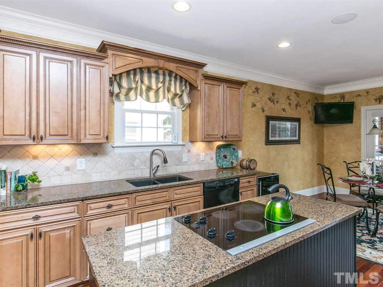 2725 Peachleaf Street Raleigh, NC 27614 - Photo 6 of 25 Granite Counters, Tile Backsplash and Center Island