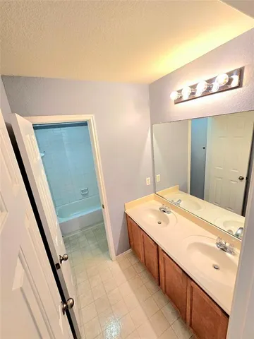 a bathroom with a sink a vanity and a mirror