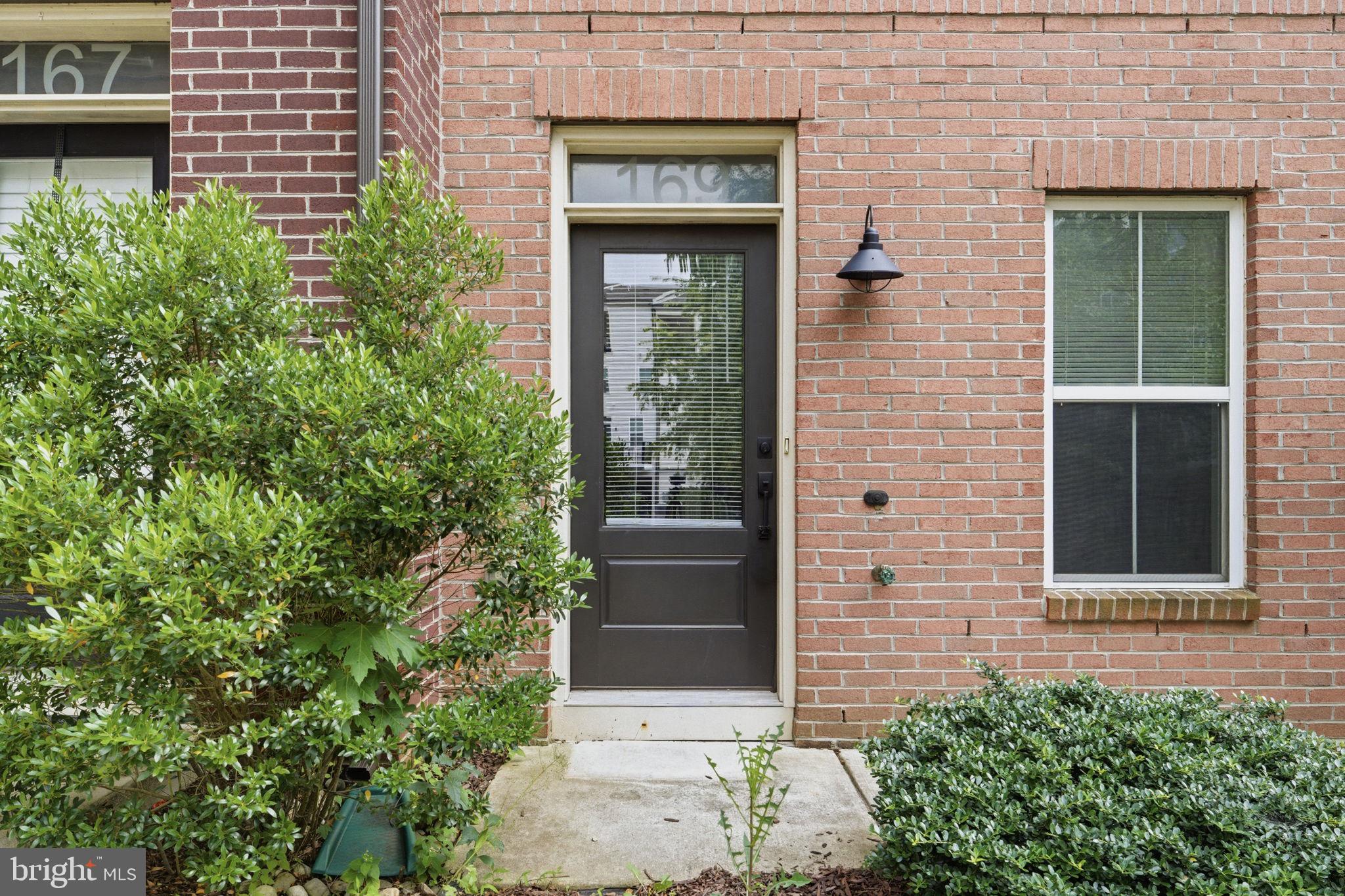 169 Kandinsky Loop Silver Spring, MD 20906 - Photo 3 of 67 Charming entryway with lush greenery.