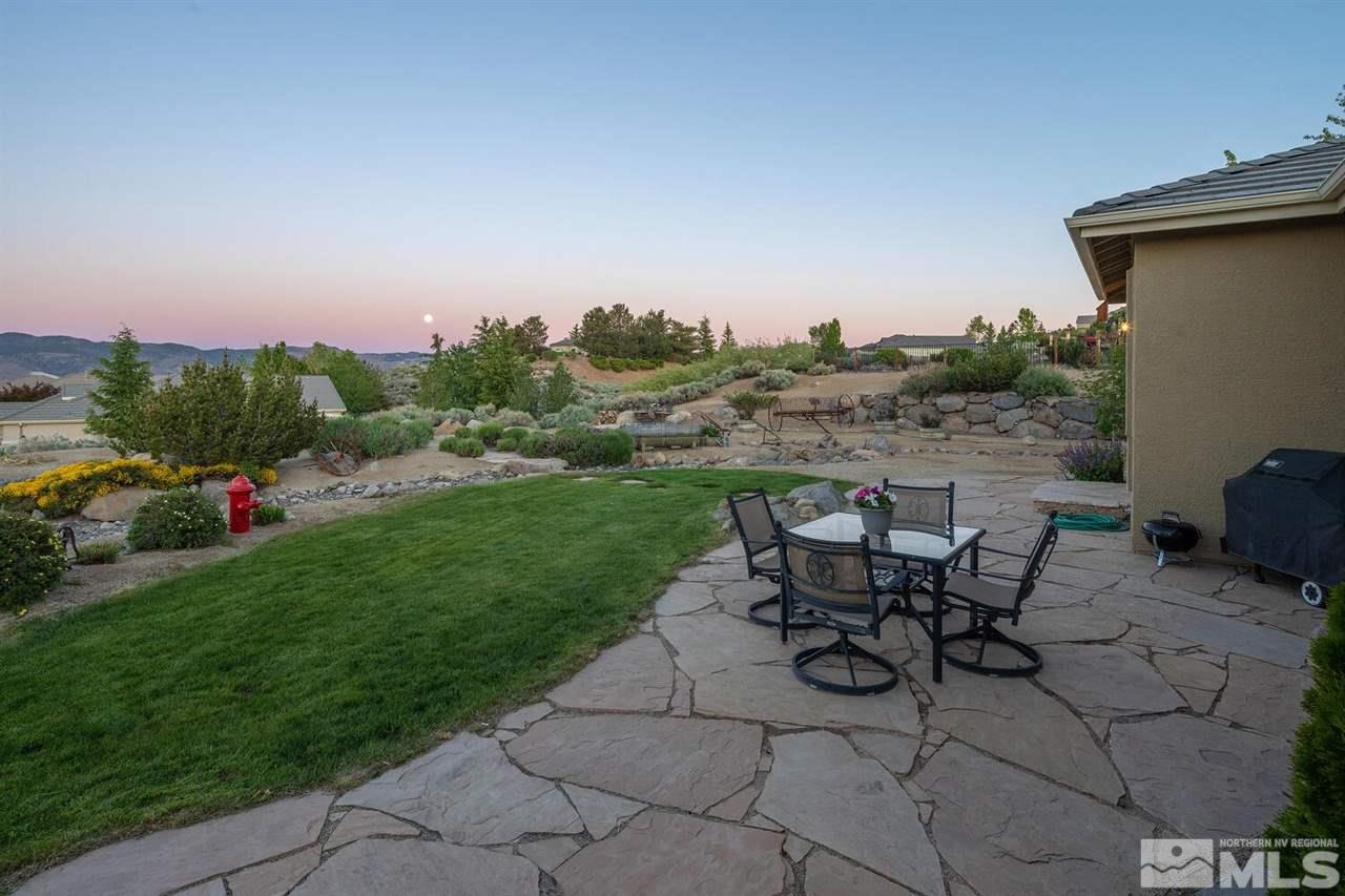 5633 North White Sands Road Reno, NV 89511 - Photo 23 of 40 a view of a backyard with sitting area