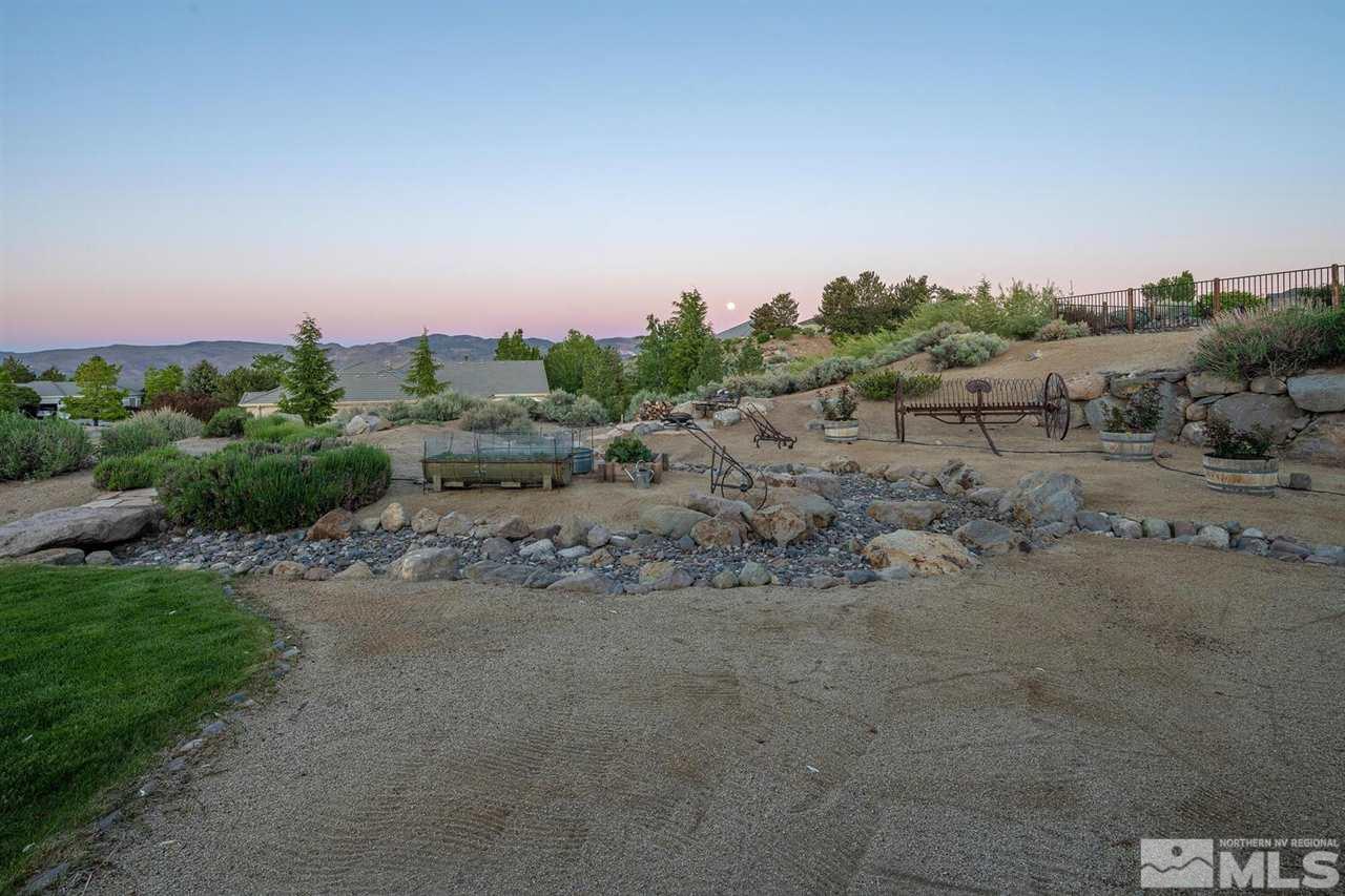 5633 North White Sands Road Reno, NV 89511 - Photo 27 of 40 a view of a dry yard with trees