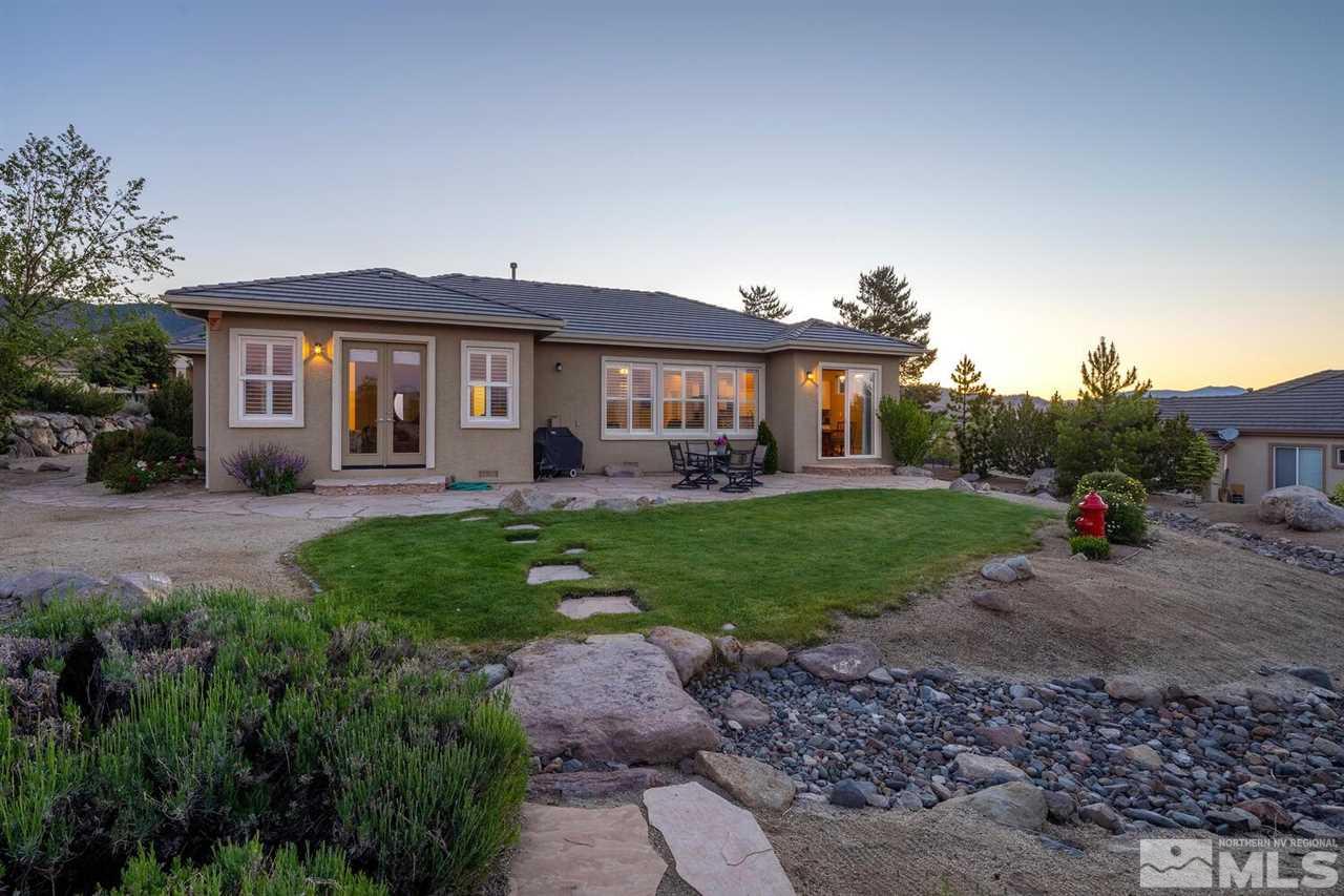 5633 North White Sands Road Reno, NV 89511 - Photo 31 of 40 a view of a house with a backyard