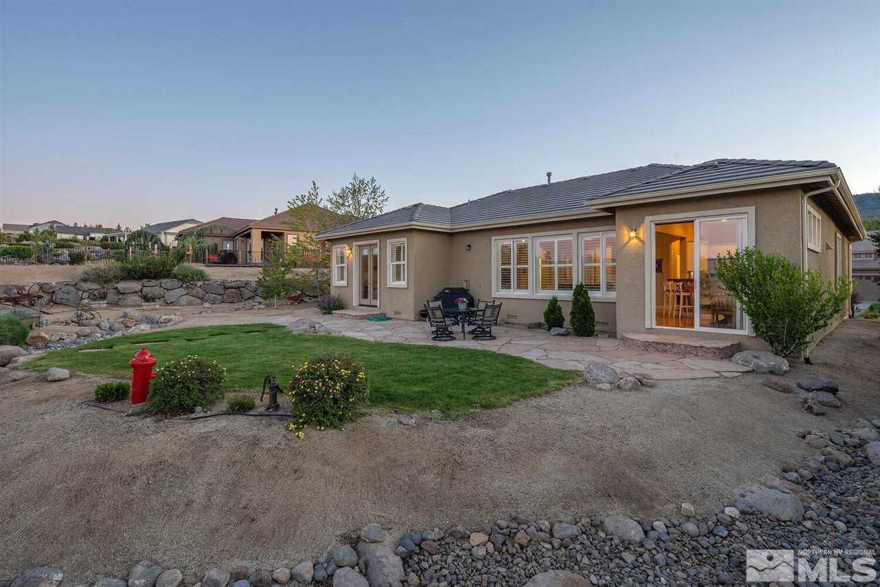 5633 North White Sands Road Reno, NV 89511 - Photo 33 of 40 a view of a house with backyard and porch