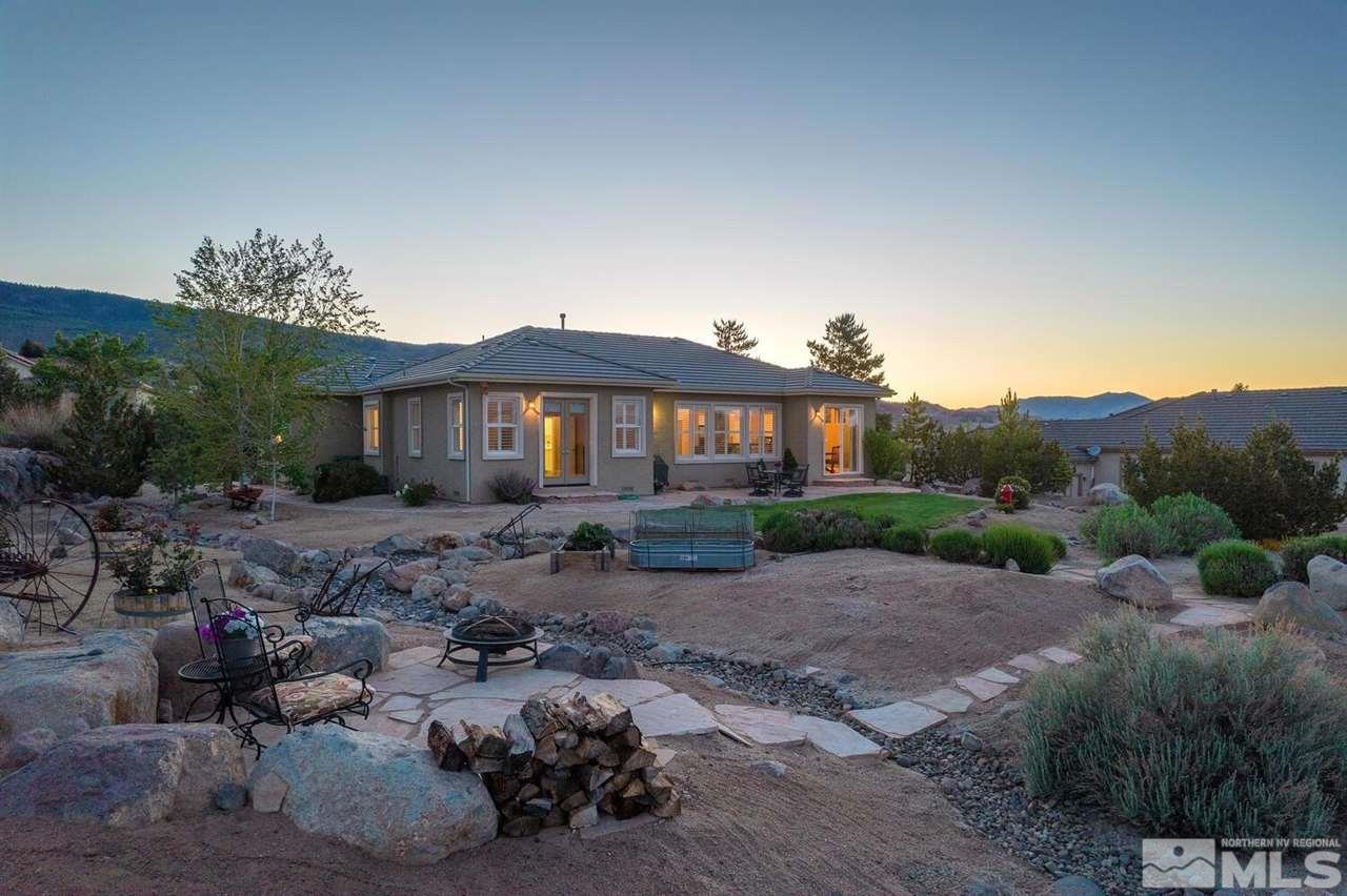 5633 North White Sands Road Reno, NV 89511 - Photo 4 of 40 a front view of a house with a yard