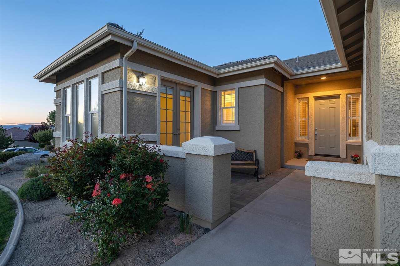 5633 North White Sands Road Reno, NV 89511 - Photo 6 of 40 a front view of a house with a yard