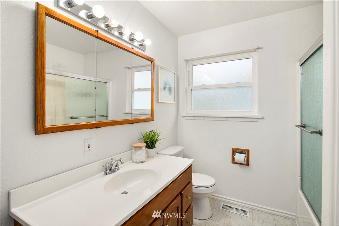 2905 Northeast 5th Place Renton, WA 98056 - Photo 22 of 36 a bathroom with a sink toilet and mirror