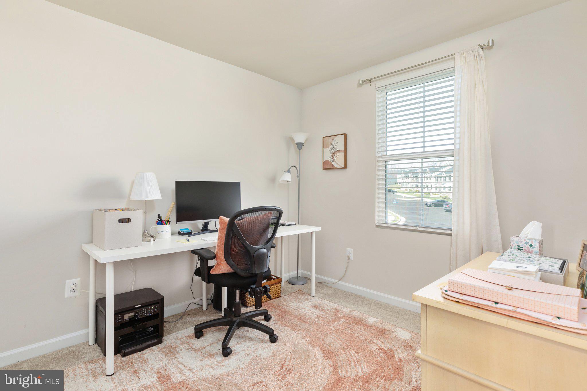 101 Williams Street Strasburg, VA 22657 - Photo 12 of 21 a view of a workspace with furniture and a window