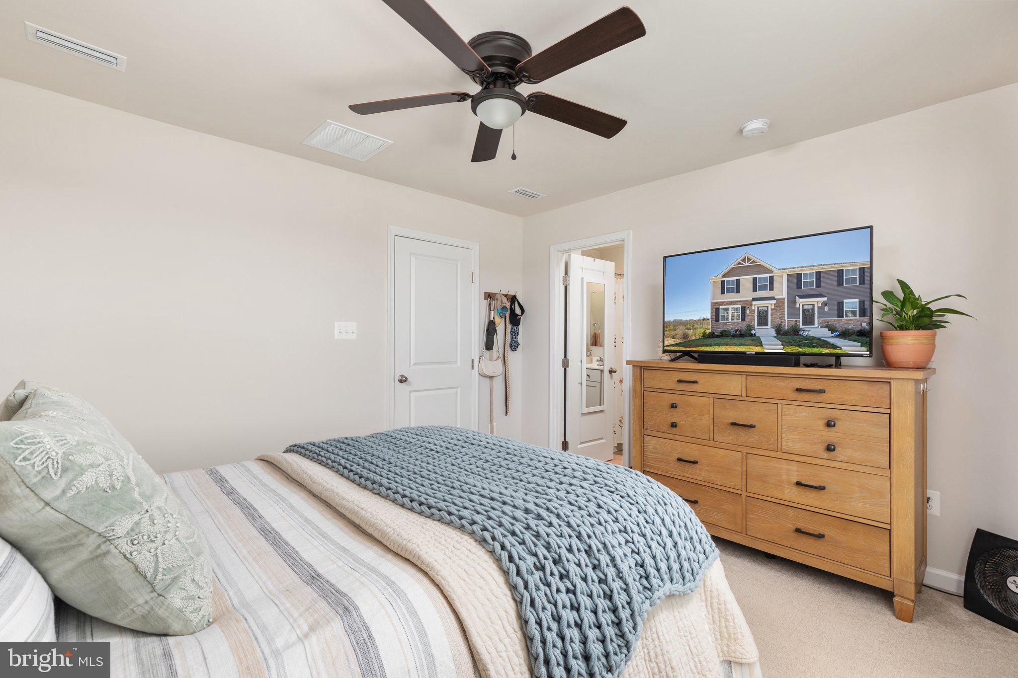 101 Williams Street Strasburg, VA 22657 - Photo 14 of 21 a bedroom with a bed and a dresser
