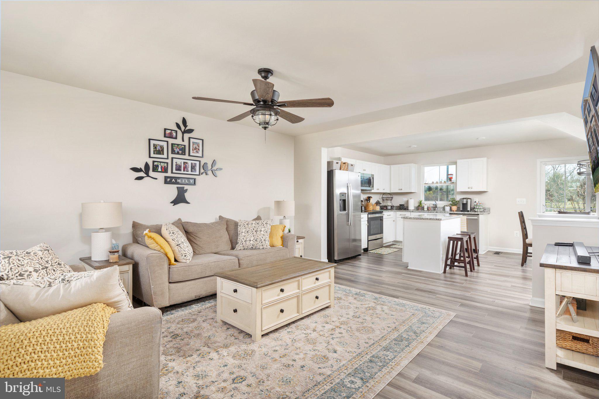 101 Williams Street Strasburg, VA 22657 - Photo 3 of 21 a living room with furniture and a wooden floor
