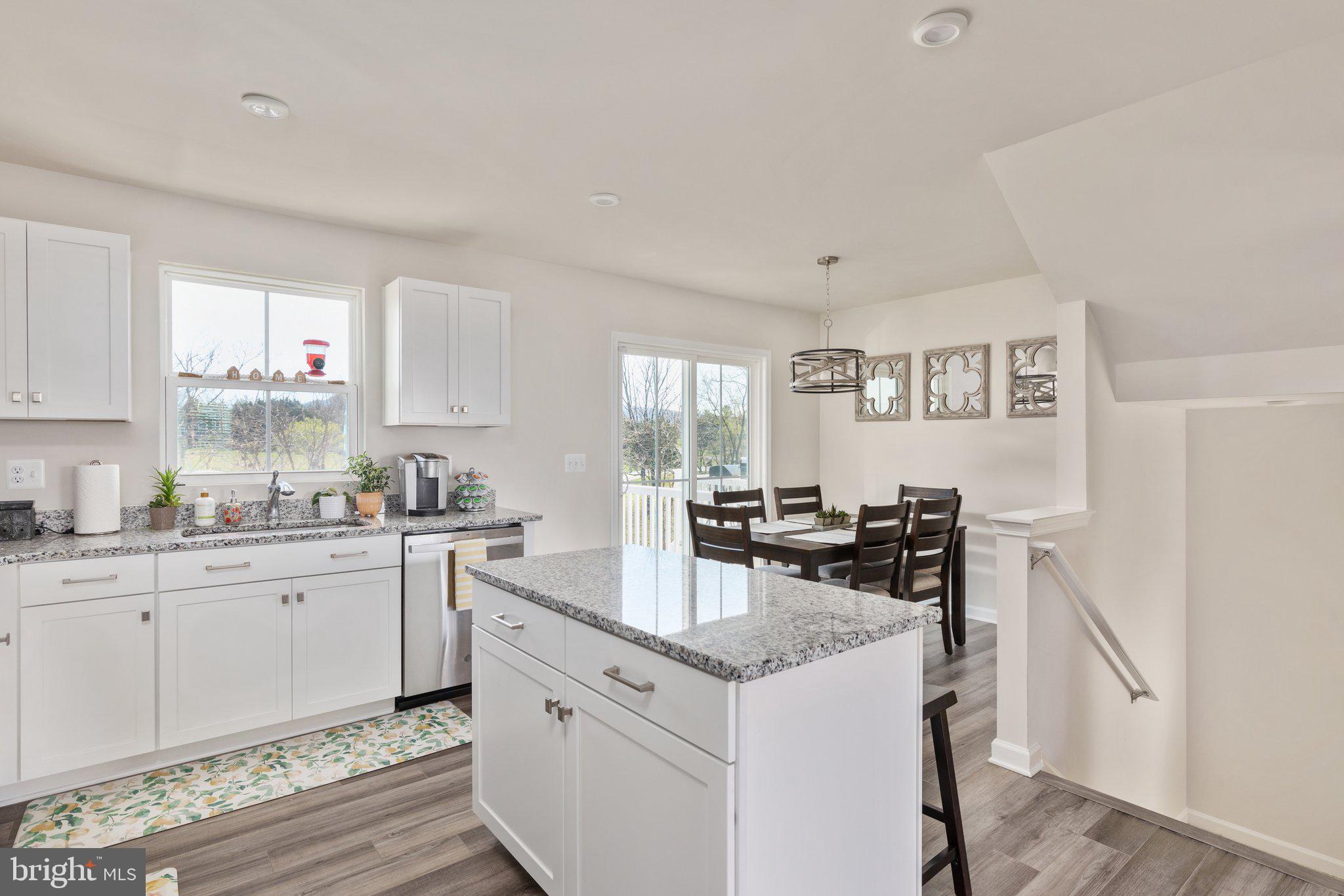 101 Williams Street Strasburg, VA 22657 - Photo 6 of 21 a kitchen with a sink stove and cabinets