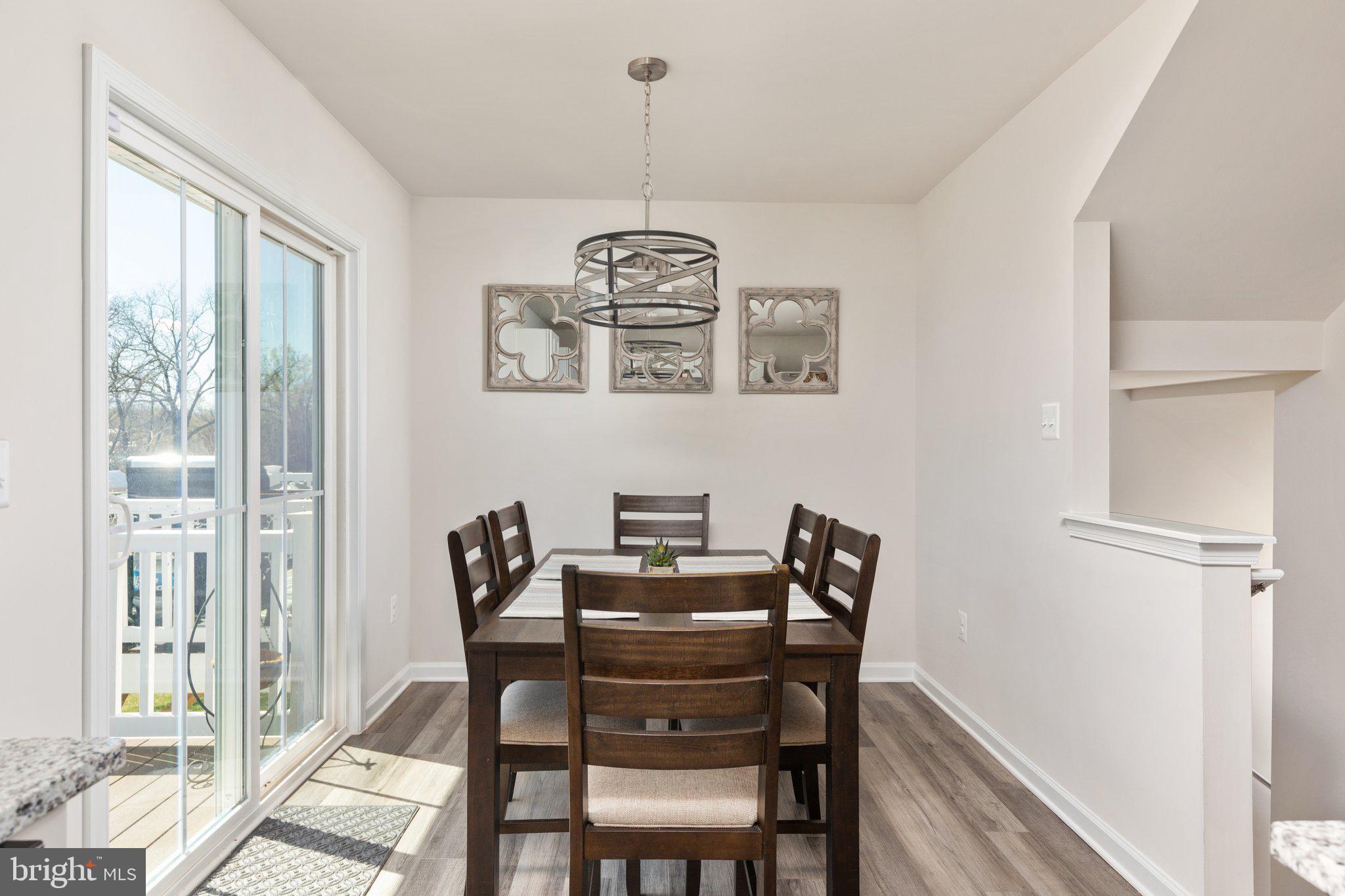 101 Williams Street Strasburg, VA 22657 - Photo 8 of 21 a view of a dining room with furniture window and wooden floor