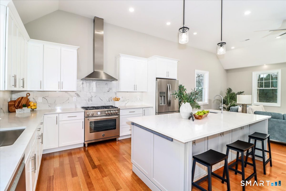 109 Codfish Hill Road Bethel, CT 06801 - Photo 11 of 43 a kitchen with a stove a sink and a refrigerator