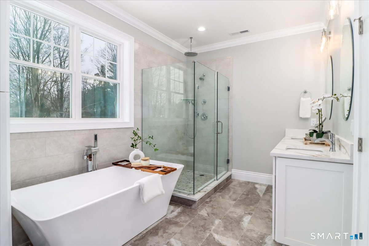 109 Codfish Hill Road Bethel, CT 06801 - Photo 18 of 43 a bathroom with a tub a sink and a window