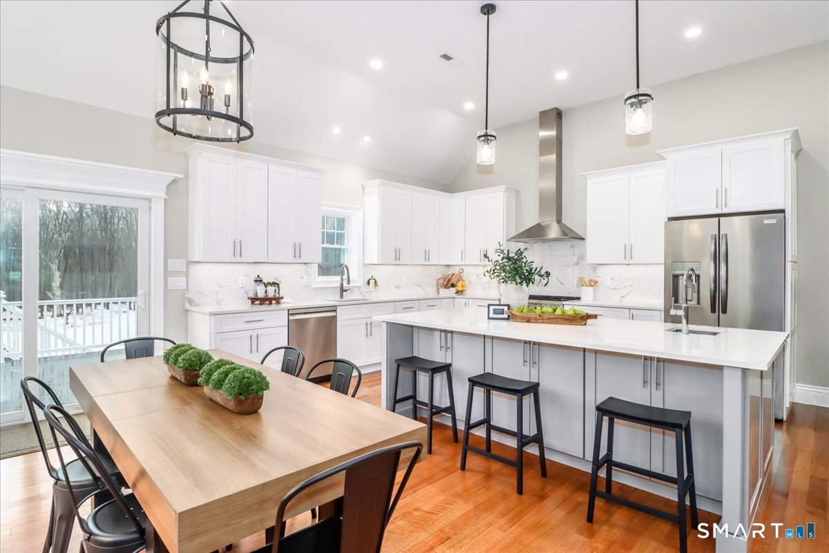 109 Codfish Hill Road Bethel, CT 06801 - Photo 20 of 43 a kitchen with kitchen island a dining table and chairs