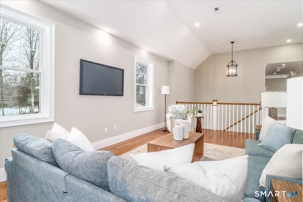 109 Codfish Hill Road Bethel, CT 06801 - Photo 2 of 43 a living room with furniture and a flat screen tv