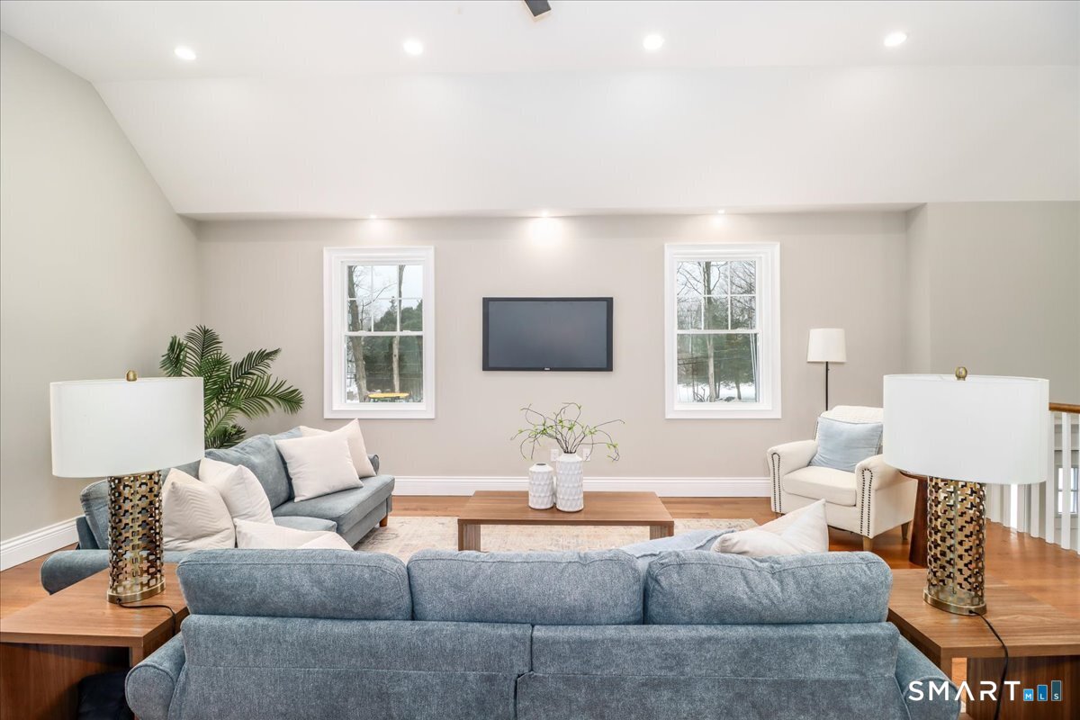 109 Codfish Hill Road Bethel, CT 06801 - Photo 21 of 43 a living room with furniture and a flat screen tv