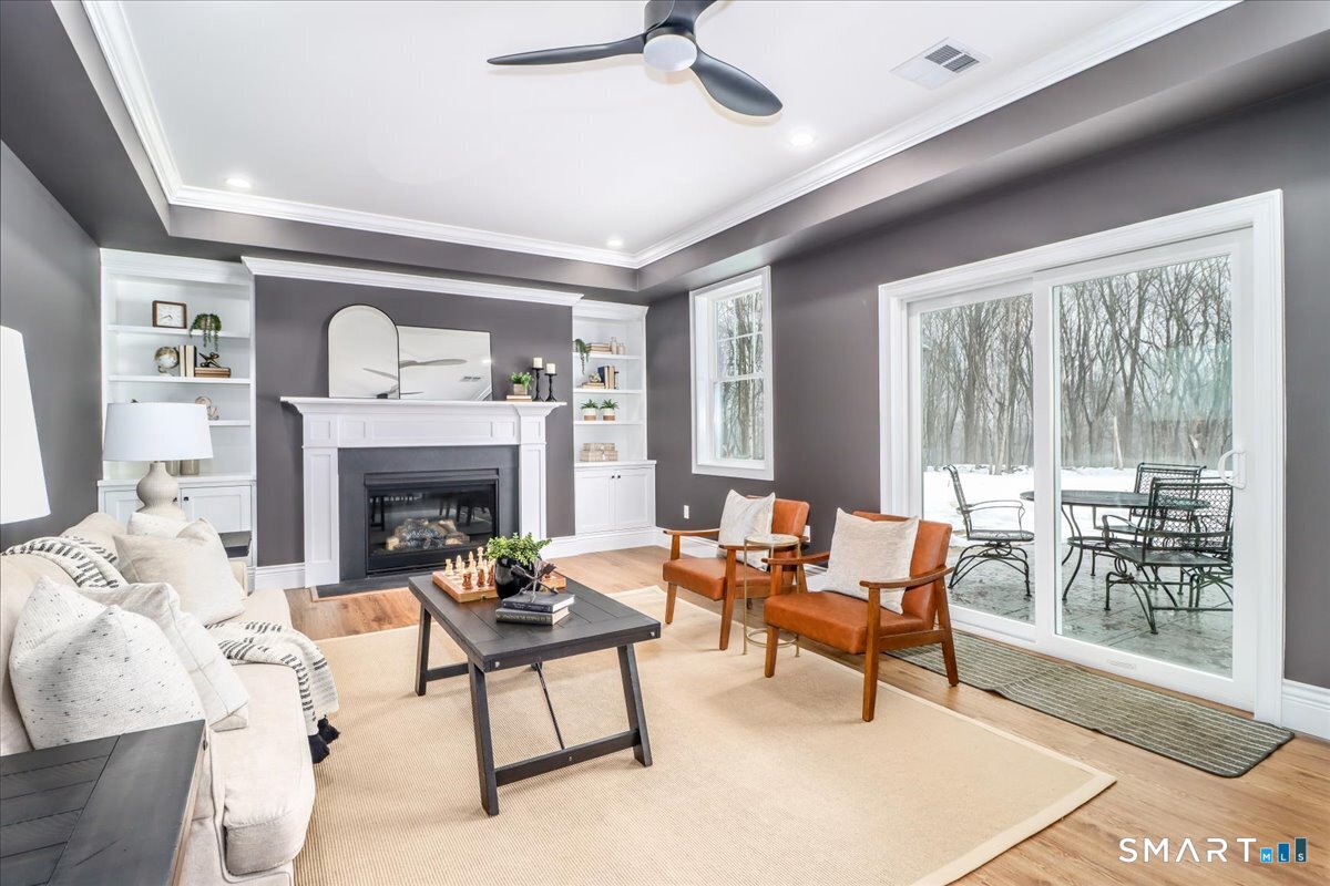109 Codfish Hill Road Bethel, CT 06801 - Photo 23 of 43 a living room with furniture and a fireplace