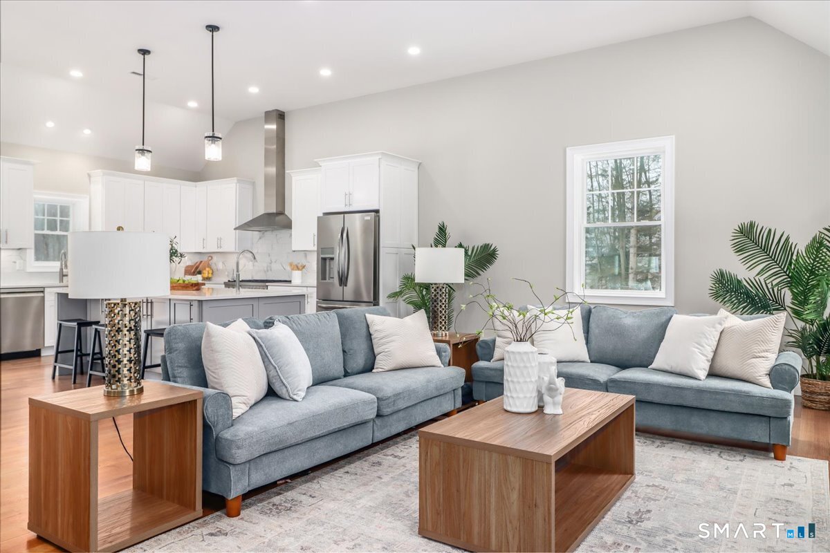 109 Codfish Hill Road Bethel, CT 06801 - Photo 25 of 43 a living room with furniture kitchen and a chandelier