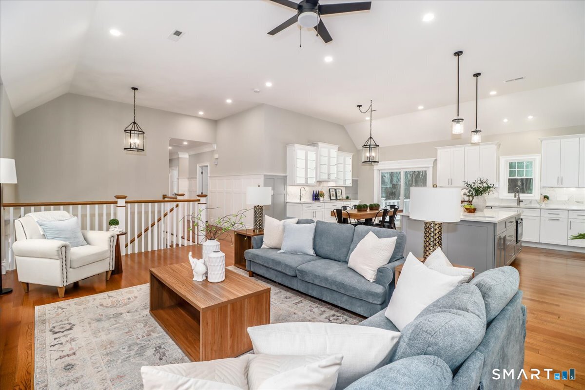 109 Codfish Hill Road Bethel, CT 06801 - Photo 26 of 43 a living room with furniture kitchen view and a chandelier