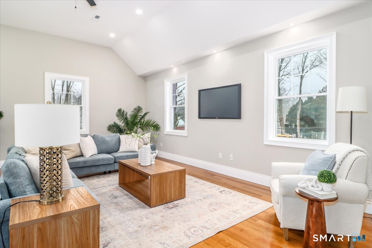 109 Codfish Hill Road Bethel, CT 06801 - Photo 27 of 43 a living room with furniture and a flat screen tv