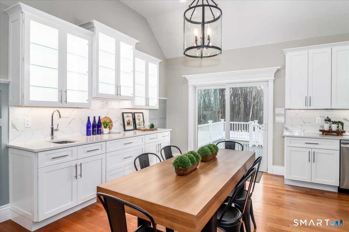 109 Codfish Hill Road Bethel, CT 06801 - Photo 30 of 43 a kitchen with a table chairs stove and cabinets