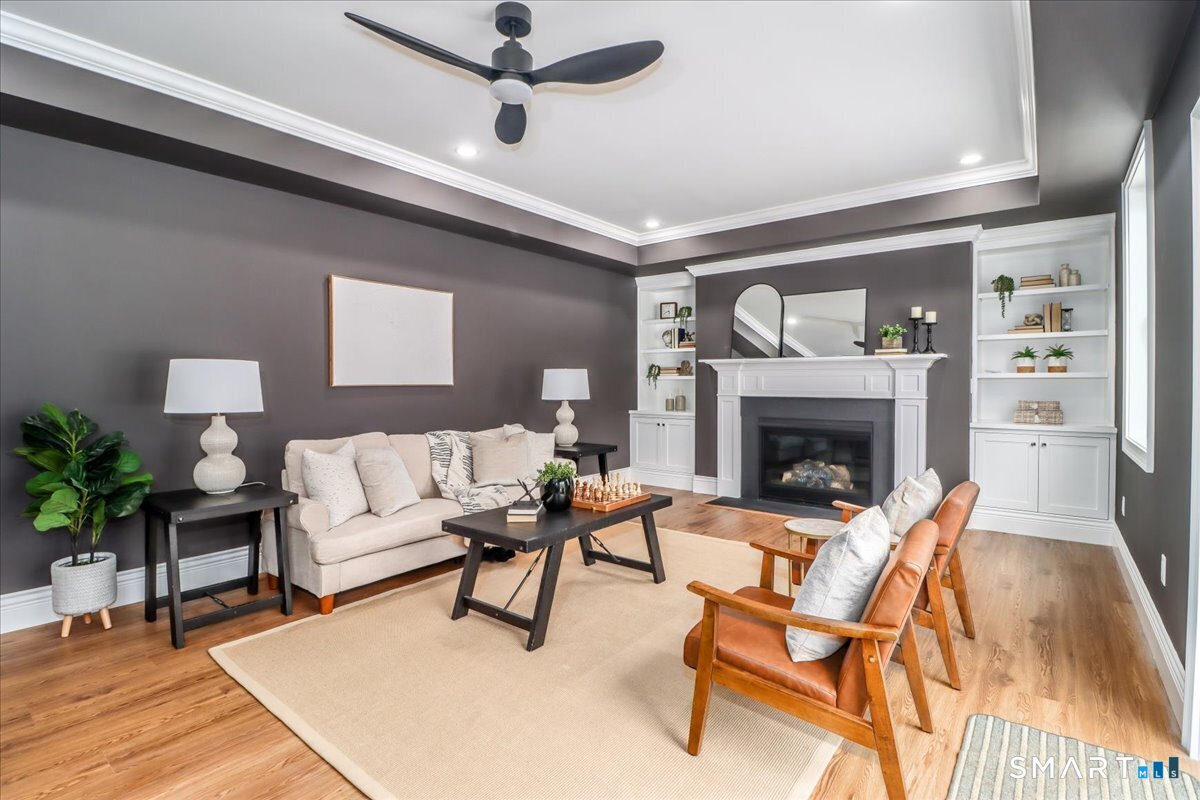 109 Codfish Hill Road Bethel, CT 06801 - Photo 8 of 43 a living room with furniture and a fireplace