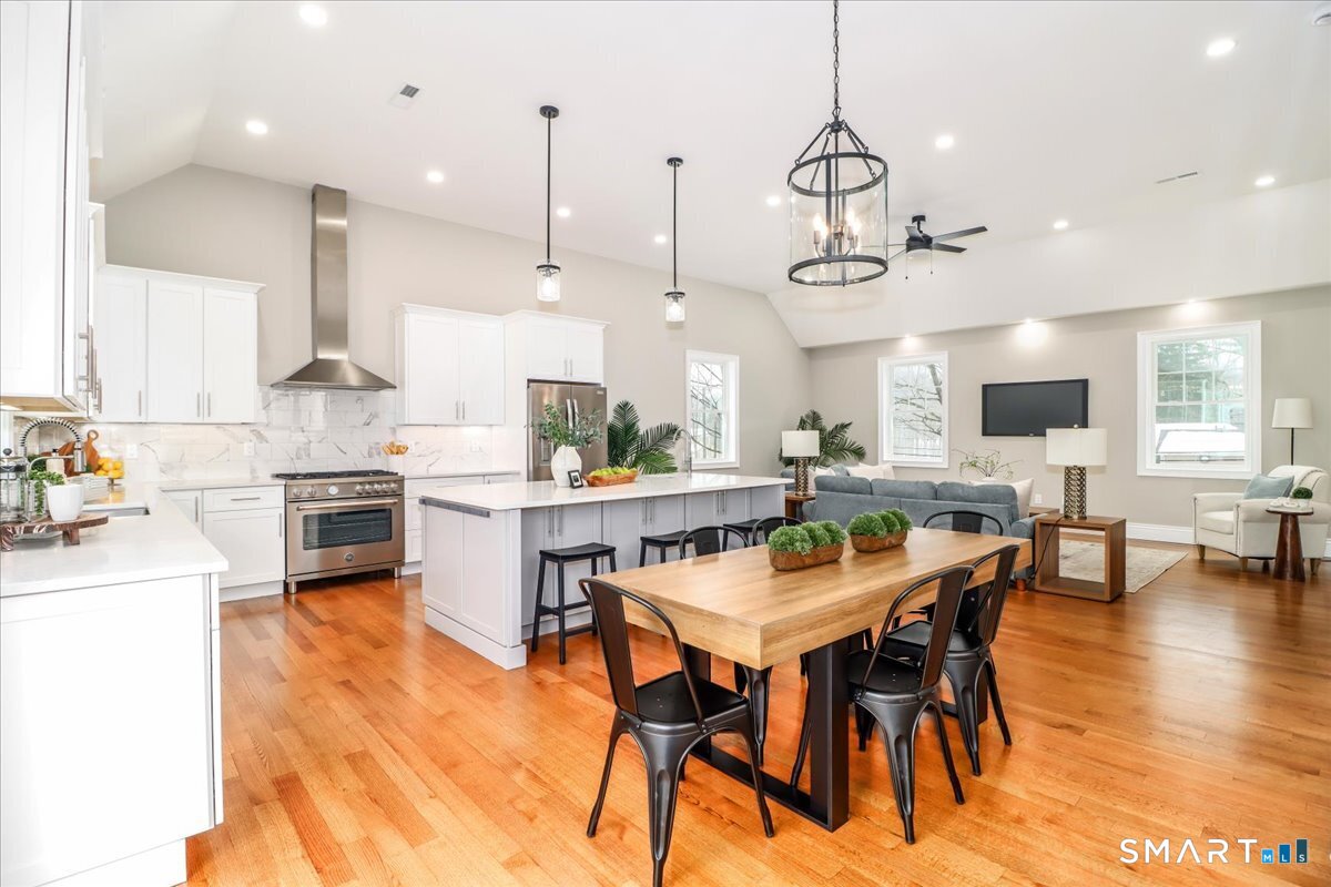 109 Codfish Hill Road Bethel, CT 06801 - Photo 9 of 43 a kitchen with stainless steel appliances kitchen island a large island in the center