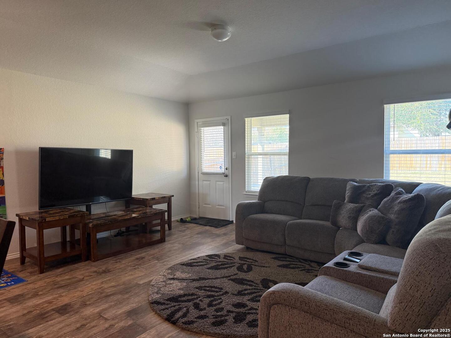 6411 Kendall Cove Converse, TX 78109 - Photo 4 of 9 a living room with furniture and a flat screen tv