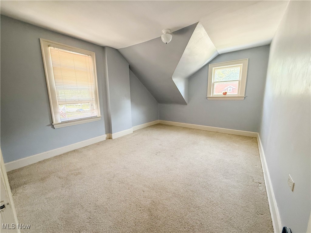 4672 Liberty Road South Euclid, OH 44121 - Photo 15 of 23 Additional living space with carpet floors and vaulted ceiling