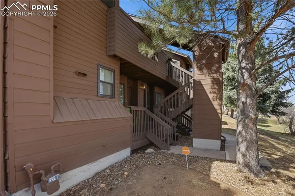 a view of entryway with wooden stairs