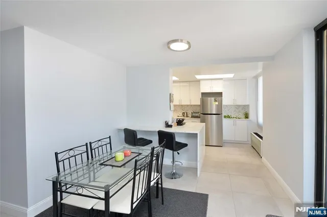 a open kitchen with a table and chairs