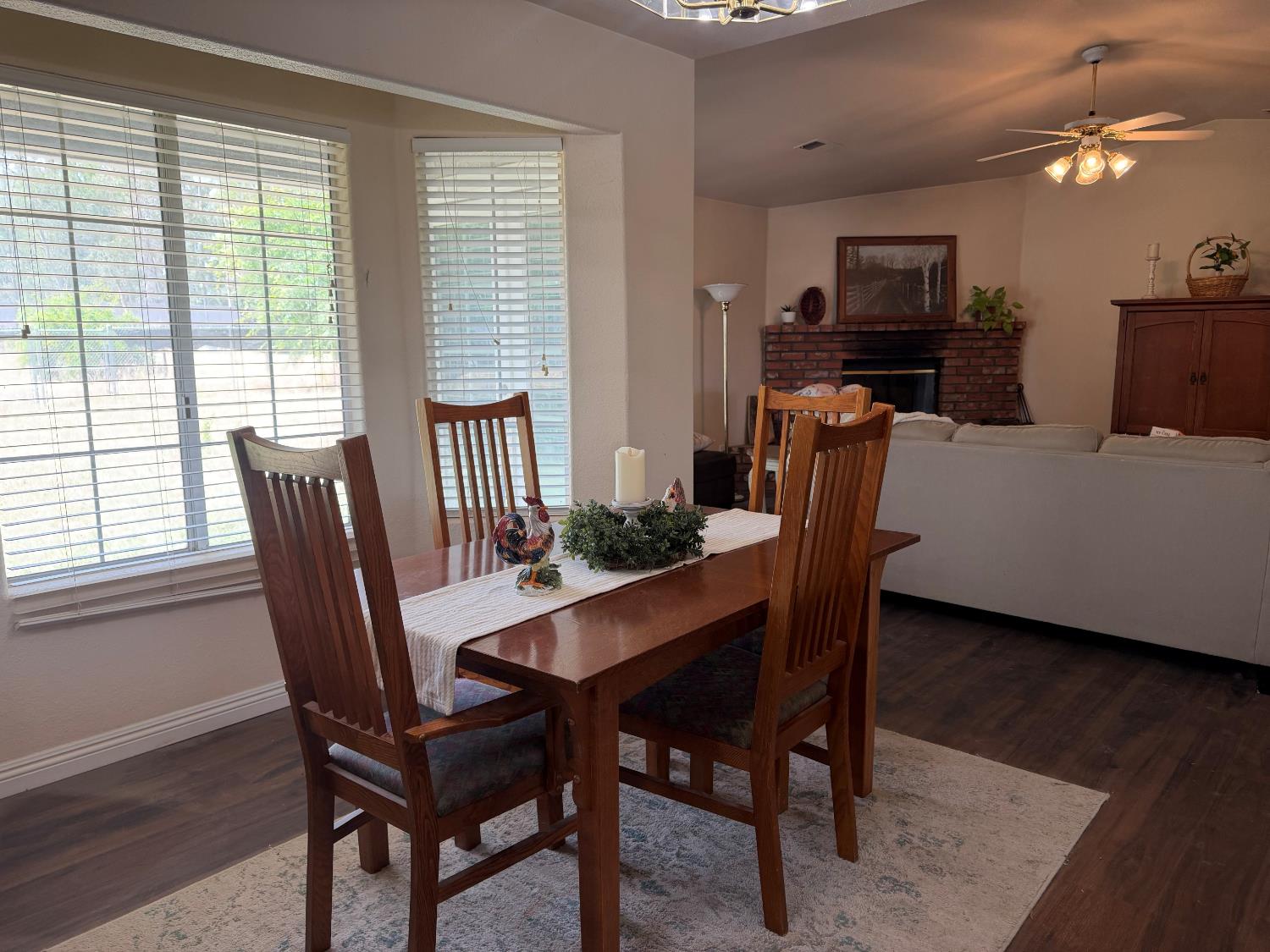 16638 Mark Road Madera, CA 93636 - Photo 7 of 22 a view of a dining room with furniture window and wooden floor
