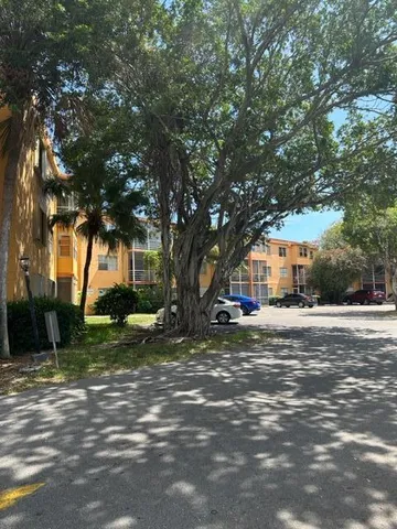 a view of a tree in front of a house