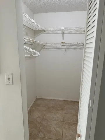 a view of a room with racks on the wall