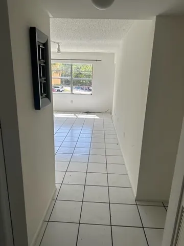 a view of empty room with windows