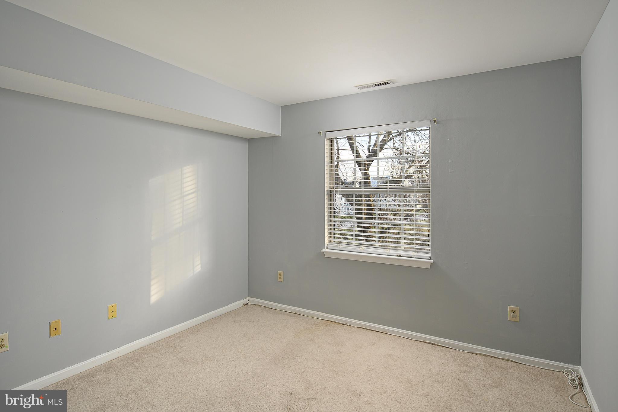 8360 Montgomery Run Road, Unit G Ellicott City, MD 21043 - Photo 18 of 20 a view of an empty room with a window