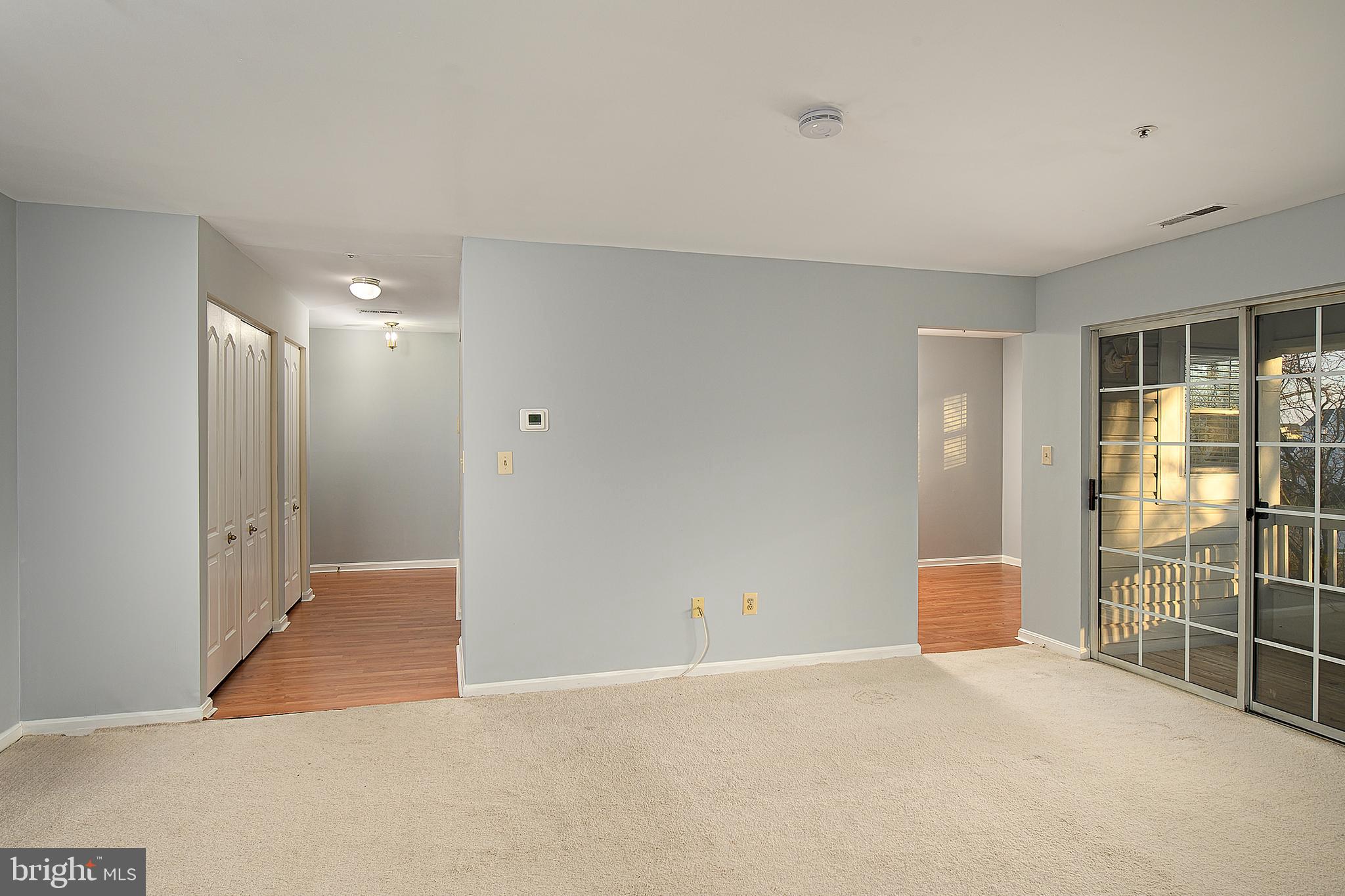 8360 Montgomery Run Road, Unit G Ellicott City, MD 21043 - Photo 2 of 20 a view of an empty room with glass door